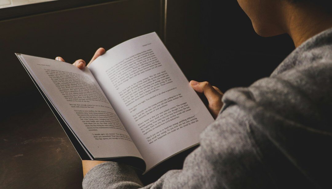 woman reading mystery book