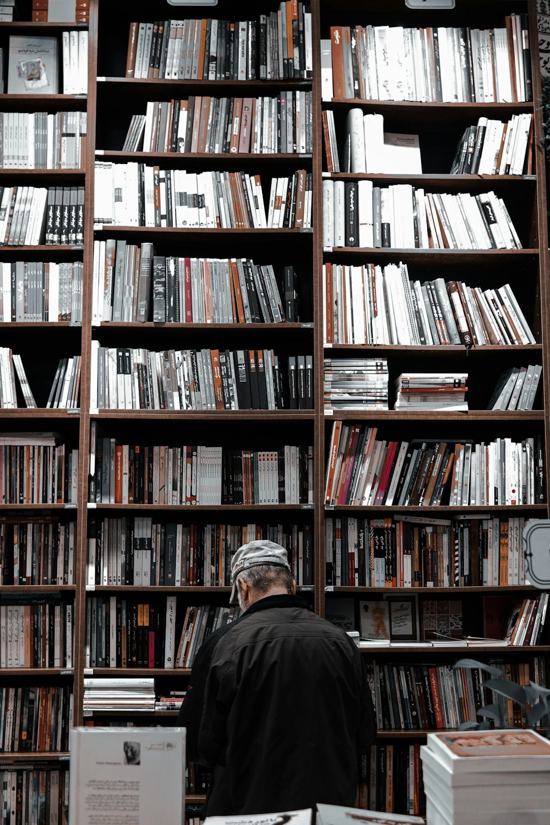 man browsing bookstore